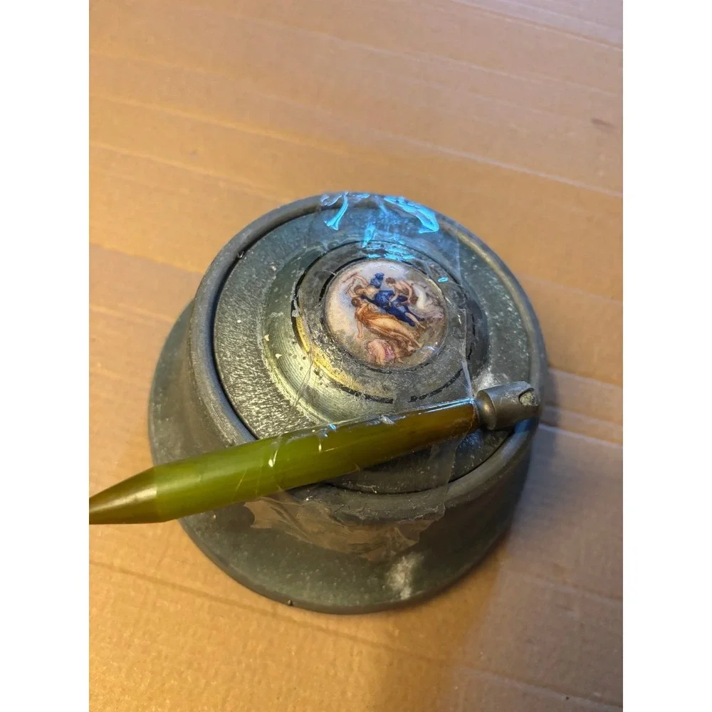 This vintage Victorian powder/music box is a rare and charming collectible piece